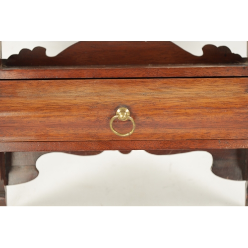 253 - A 19TH CENTURY MAHOGANY HANGING PIPE RACK with shaped drawer to the base. (53cm high 33cm wide)