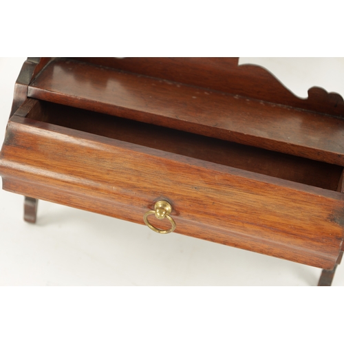 253 - A 19TH CENTURY MAHOGANY HANGING PIPE RACK with shaped drawer to the base. (53cm high 33cm wide)