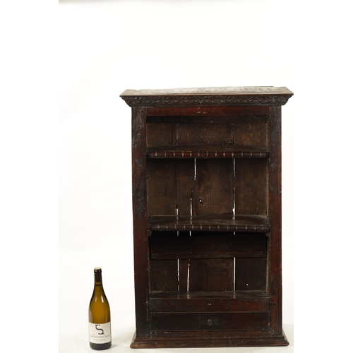 256 - A 17TH CENTURY OAK HANGING OPEN SPICE RACK WITH FITTED DRAWER (60cm wide 26cm deep 92cm high)