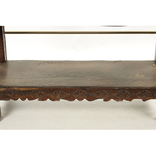 257 - A 17TH CENTURY CARVED OAK BUFFET with top drawer above an angled cupboard and open base. (119cm wide... 