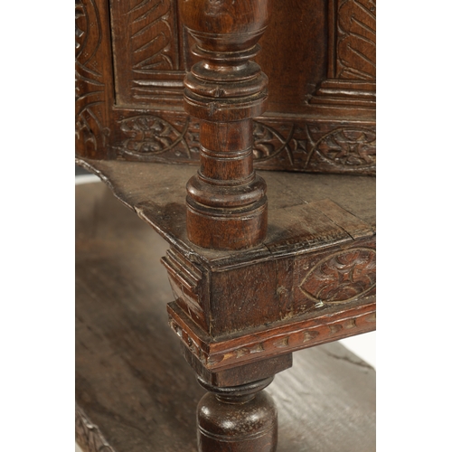 257 - A 17TH CENTURY CARVED OAK BUFFET with top drawer above an angled cupboard and open base. (119cm wide... 