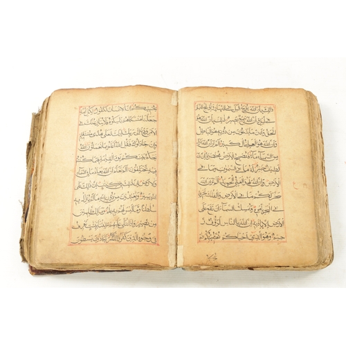 258 - AN EARLY COPY OF THE KORAN LEATHER BOUND BOOK (28cm high 21cm wide)