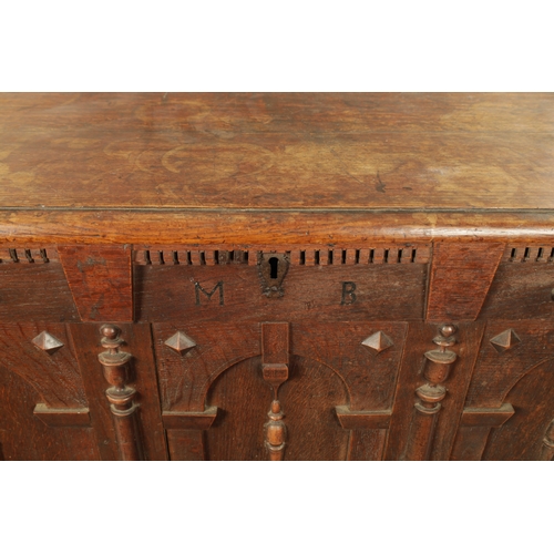 260 - A 17TH CENTURY JACOBEAN OAK LAUDIAN COFFER with moulded edge top above geometric moulded front. (127... 