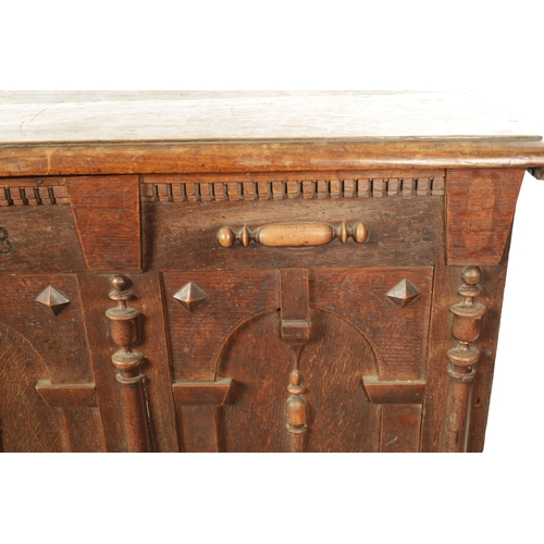 260 - A 17TH CENTURY JACOBEAN OAK LAUDIAN COFFER with moulded edge top above geometric moulded front. (127... 