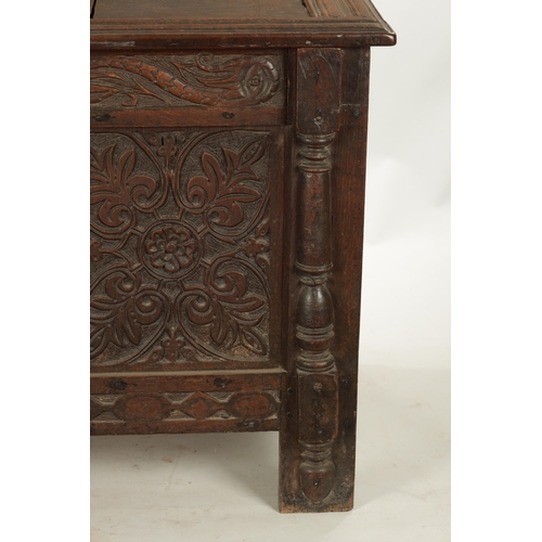 261 - A 17TH CENTURY CARVED OAK THREE PANELLED FRONT COFFER with panelled top and stile feet (141cm wide 6... 