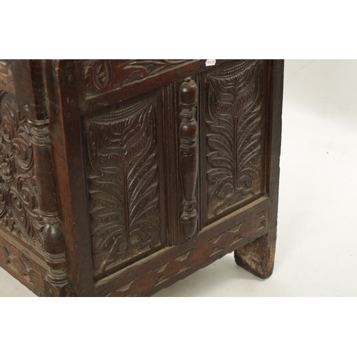 261 - A 17TH CENTURY CARVED OAK THREE PANELLED FRONT COFFER with panelled top and stile feet (141cm wide 6... 