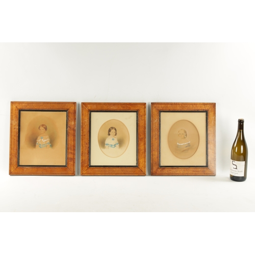 264 - A SET OF THREE EDWARDIAN WATERCOLOURS OF CHILDREN signed - mounted in glazed maple frames (19cm high... 