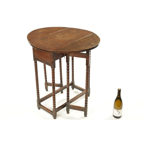 266 - A RARE CROMWELLIAN OAK DROP LEAF GATELEG TABLE OF SMALL SIZE raised on bobbin turned legs joined by ... 