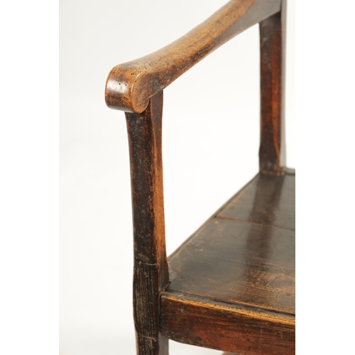 276 - AN 18TH CENTURY PRIMITIVE ASH AND ELM COUNTRY ARMCHAIR with solid shaped back splat and plank seat. ... 