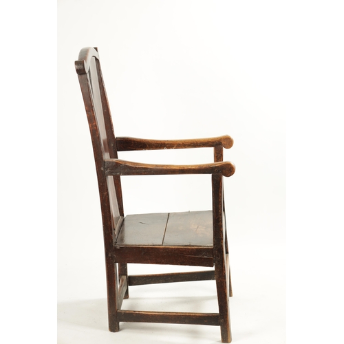 276 - AN 18TH CENTURY PRIMITIVE ASH AND ELM COUNTRY ARMCHAIR with solid shaped back splat and plank seat. ... 