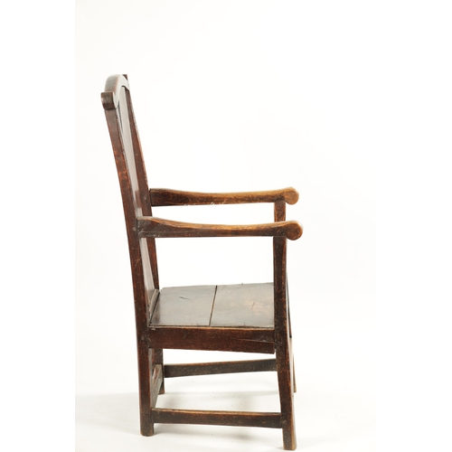 276 - AN 18TH CENTURY PRIMITIVE ASH AND ELM COUNTRY ARMCHAIR with solid shaped back splat and plank seat. ... 