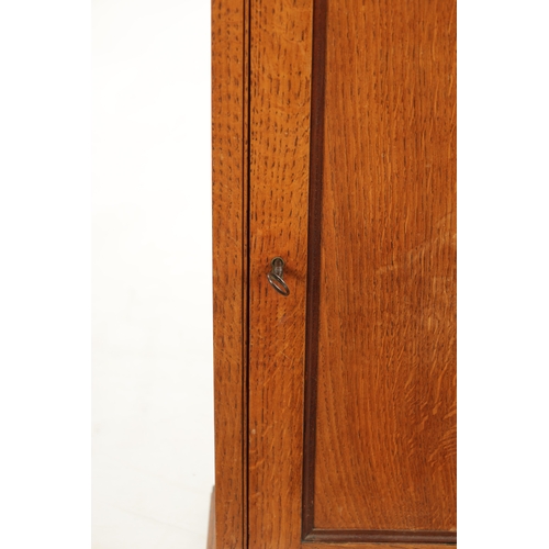 279 - AN EARLY 19TH CENTURY OAK TABLE CABINET with hinged doors revealing shelves and small drawers (43cm ... 