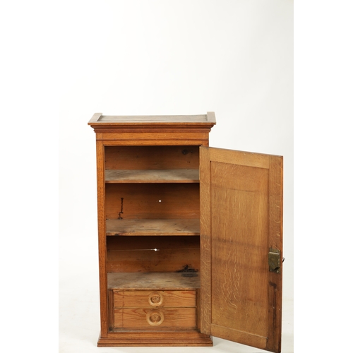 279 - AN EARLY 19TH CENTURY OAK TABLE CABINET with hinged doors revealing shelves and small drawers (43cm ... 