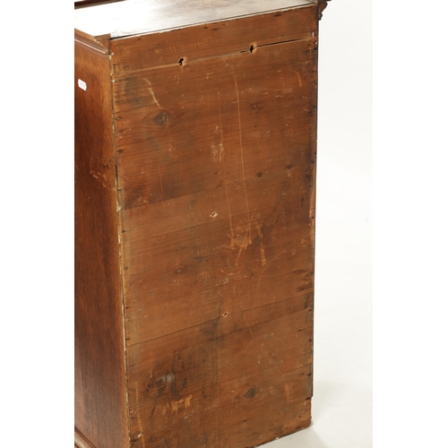 279 - AN EARLY 19TH CENTURY OAK TABLE CABINET with hinged doors revealing shelves and small drawers (43cm ... 