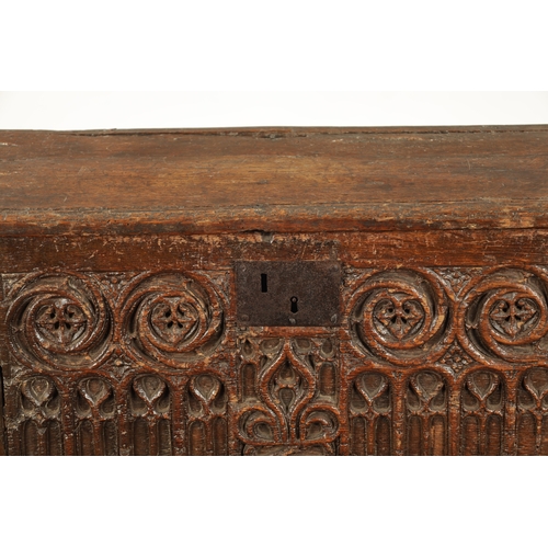 28 - A RARE 15TH/16TH CENTURY GOTHIC OAK PLANK COFFER OF SMALL SIZE with fret cut carved front (80cm wide... 