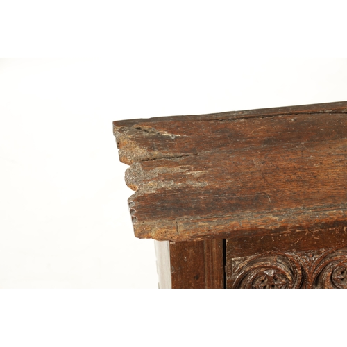 28 - A RARE 15TH/16TH CENTURY GOTHIC OAK PLANK COFFER OF SMALL SIZE with fret cut carved front (80cm wide... 