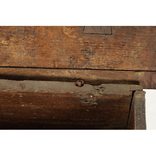 28 - A RARE 15TH/16TH CENTURY GOTHIC OAK PLANK COFFER OF SMALL SIZE with fret cut carved front (80cm wide... 