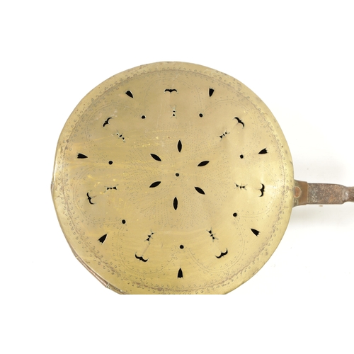 284 - A 17TH CENTURY BRASS WARMING PAN AND AN 18TH CENTURY BRASS PIERCED WARMING PAN one with an iron hand... 