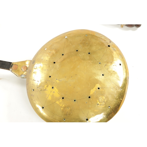 284 - A 17TH CENTURY BRASS WARMING PAN AND AN 18TH CENTURY BRASS PIERCED WARMING PAN one with an iron hand... 