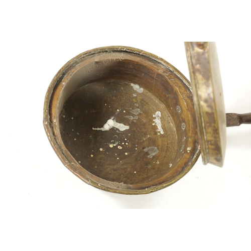 284 - A 17TH CENTURY BRASS WARMING PAN AND AN 18TH CENTURY BRASS PIERCED WARMING PAN one with an iron hand... 