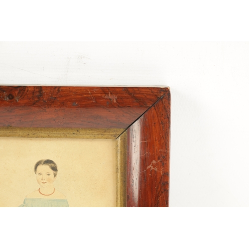 286 - A REGENCY NAÏVE WATERCOLOUR STANDING PORTRAIT OF A CHILD in a Rosewood frame (15cm high 13cm wide)