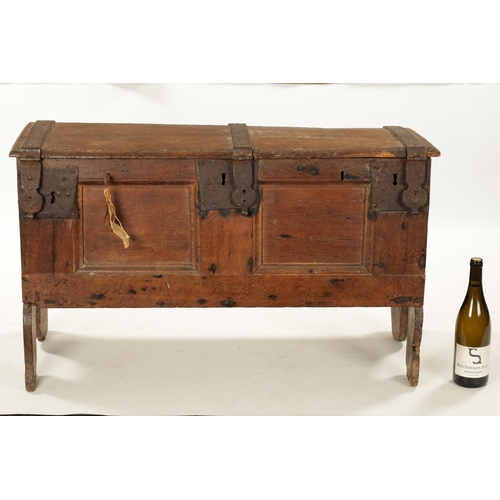 288 - A RARE 16TH / 17TH CENTURY OAK IRON BOUND STRONG BOX / PLANK COFFER with unusual triple lock panelle... 