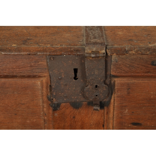 288 - A RARE 16TH / 17TH CENTURY OAK IRON BOUND STRONG BOX / PLANK COFFER with unusual triple lock panelle... 