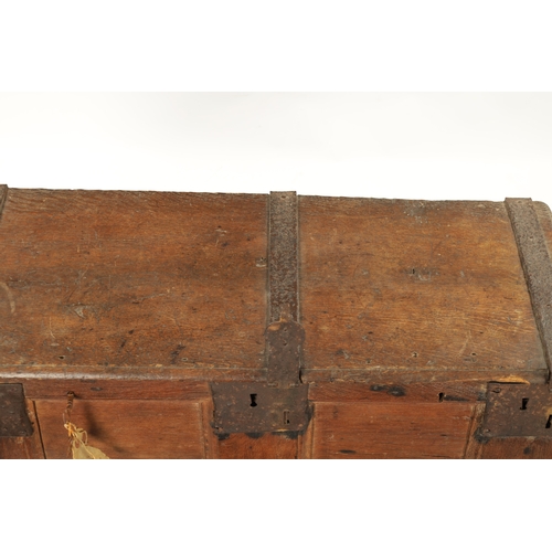 288 - A RARE 16TH / 17TH CENTURY OAK IRON BOUND STRONG BOX / PLANK COFFER with unusual triple lock panelle... 