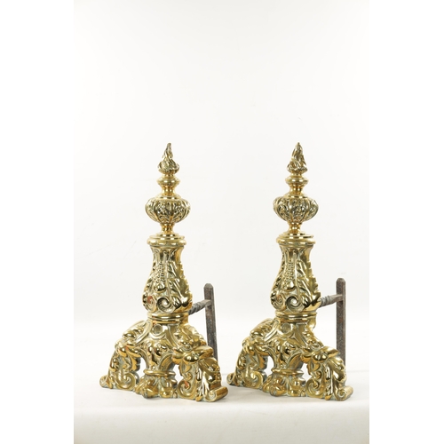 289 - A PAIR OF 19TH CENTURY BRASS AND IRON FIRE DOGS OF LARGE SIZE of leaf cast design (57cm high 26cm de... 