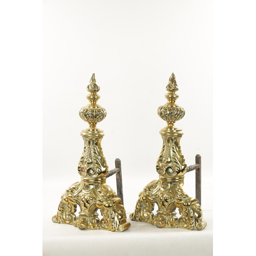 289 - A PAIR OF 19TH CENTURY BRASS AND IRON FIRE DOGS OF LARGE SIZE of leaf cast design (57cm high 26cm de... 