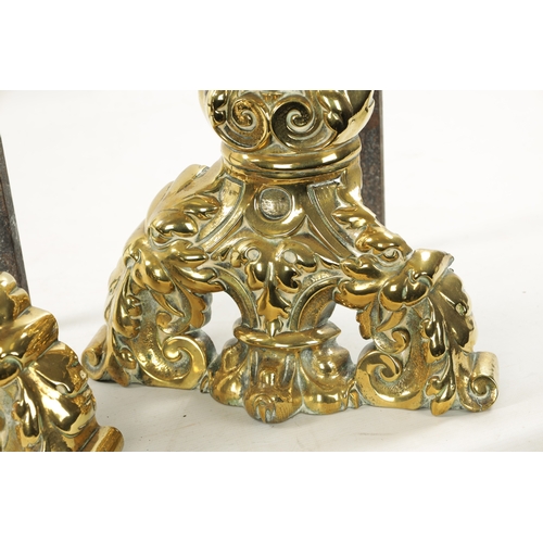 289 - A PAIR OF 19TH CENTURY BRASS AND IRON FIRE DOGS OF LARGE SIZE of leaf cast design (57cm high 26cm de... 