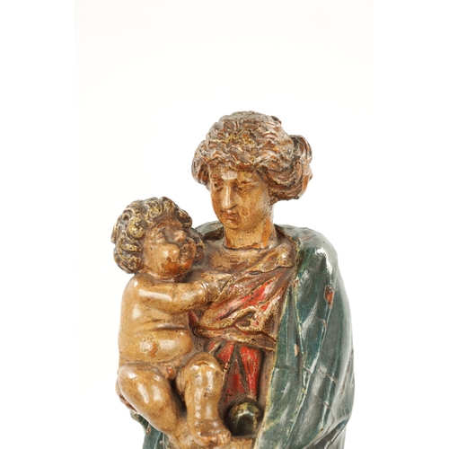 291 - AN EARLY 18TH CENTURY POLYCHROME CARVING OF MADONNA AND CHILD mounted on a square moulded canvas bas... 