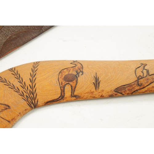 298 - AN ABORIGINAL MULGA WOOD SPEAR THROWER WITH CARVED ANIMALS AND AN OLD BOOMERANG. (76cm overall)