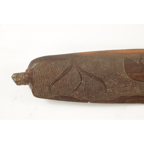 298 - AN ABORIGINAL MULGA WOOD SPEAR THROWER WITH CARVED ANIMALS AND AN OLD BOOMERANG. (76cm overall)