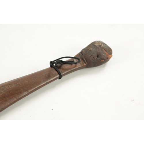 298 - AN ABORIGINAL MULGA WOOD SPEAR THROWER WITH CARVED ANIMALS AND AN OLD BOOMERANG. (76cm overall)