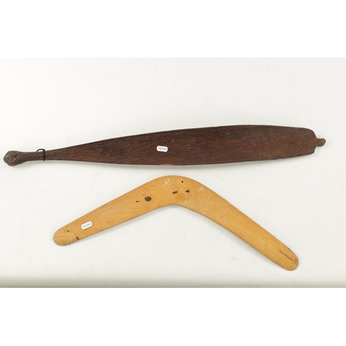 298 - AN ABORIGINAL MULGA WOOD SPEAR THROWER WITH CARVED ANIMALS AND AN OLD BOOMERANG. (76cm overall)