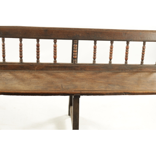 3 - AN EARLY 18TH CENTURY OAK SPINDLE BACK BENCH with plank seat; raised on splayed legs (289cm long 92c... 