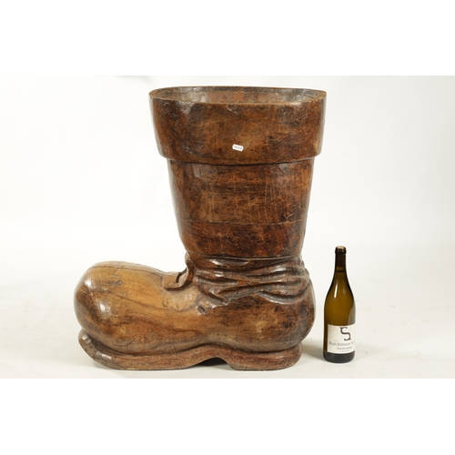 305 - A RARE 19TH CENTURY CARVED FRUITWOOD COBBLER’S ADVERTISING SIGN formed as a boot (68cm high 60cm dee... 