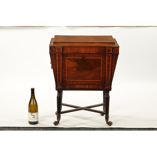 315 - A REGENCY INLAID MAHOGANY CELLARETTE ON TAPERED FLUTED LEGS IN THE MANNER OF GILLOWS with lion's hea... 