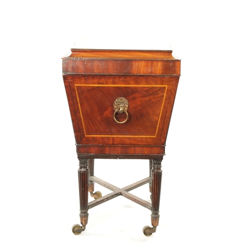 315 - A REGENCY INLAID MAHOGANY CELLARETTE ON TAPERED FLUTED LEGS IN THE MANNER OF GILLOWS with lion's hea... 