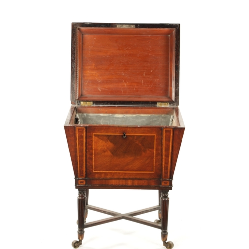 315 - A REGENCY INLAID MAHOGANY CELLARETTE ON TAPERED FLUTED LEGS IN THE MANNER OF GILLOWS with lion's hea... 