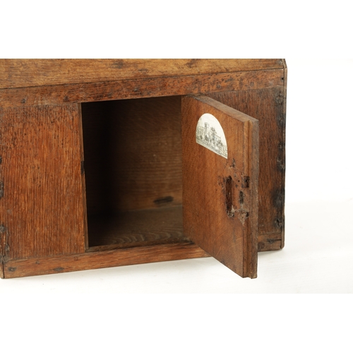 317 - A RARE SMALL 17TH CENTURY CHURCH AUMBRY CUPBOARD with roof pitch top and hinged front door. (36cm wi... 