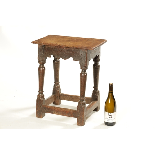 318 - A 17TH CENTURY OAK JOINT STOOL with pegged top above a ring turned base joined by stretchers (46cm w... 