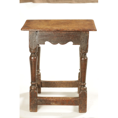 318 - A 17TH CENTURY OAK JOINT STOOL with pegged top above a ring turned base joined by stretchers (46cm w... 