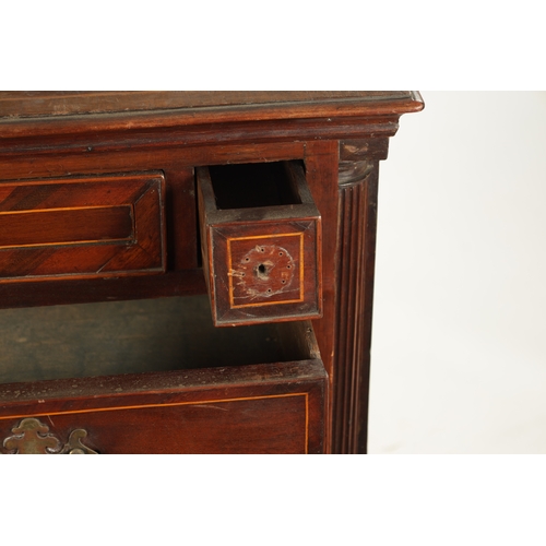 321 - AN 18TH CENTURY FIGURED MAHOGANY CHEST OF DRAWERS with unusual drawer lay out having three inlaid fr... 