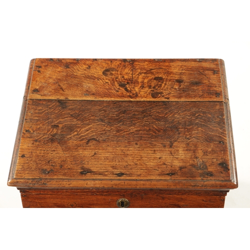 324 - A QUEEN ANNE OAK BOX STOOL with hinged top and moulded front (55cm wide 46cm deep 47cm high)