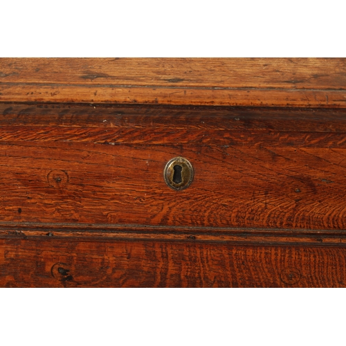 324 - A QUEEN ANNE OAK BOX STOOL with hinged top and moulded front (55cm wide 46cm deep 47cm high)