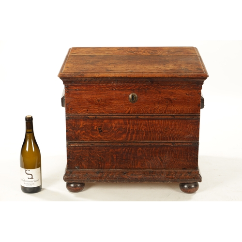 324 - A QUEEN ANNE OAK BOX STOOL with hinged top and moulded front (55cm wide 46cm deep 47cm high)