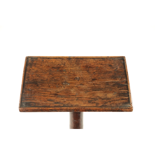 326 - AN 18TH CENTURY PRIMITIVE OAK FOUR-LEGGED CANDLE TABLE with rectangular top raised on ring turned st... 