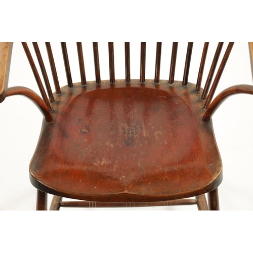 327 - A 19TH CENTURY PRIMITIVE PAINTED STICK BACK WINDSOR ARMCHAIR having an unusual high back raised on r... 